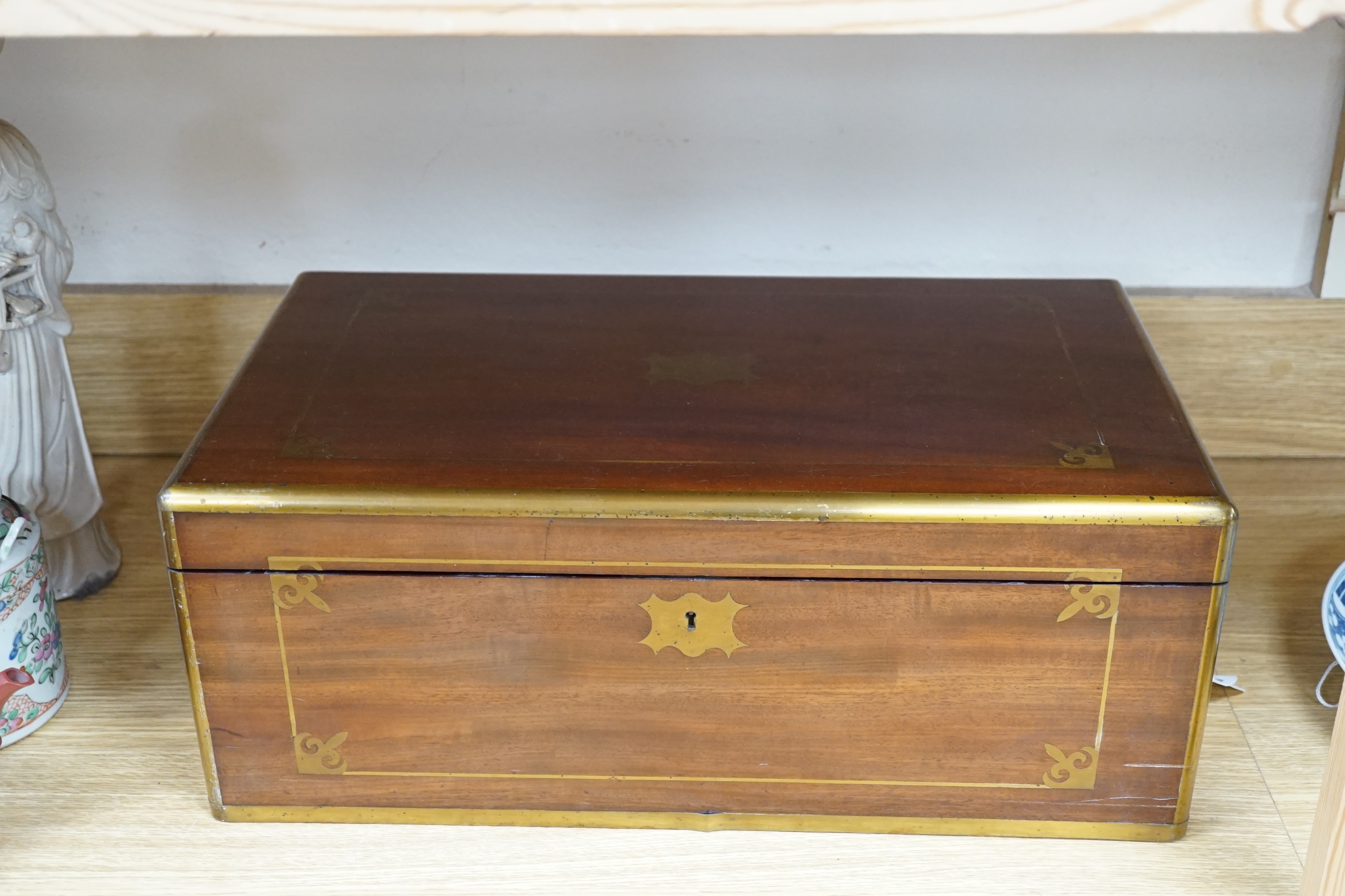 A brass inlaid mahogany writing slope, Coromandel covers to interior, 49cm wide